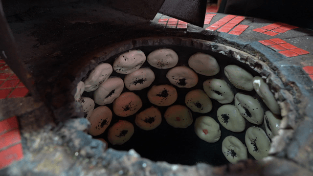 Fire oven dumplings baked in a traditional oven