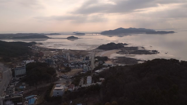 Coastal village with distant mountains