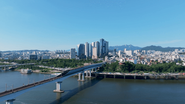 Cityscape with river and metro bridge