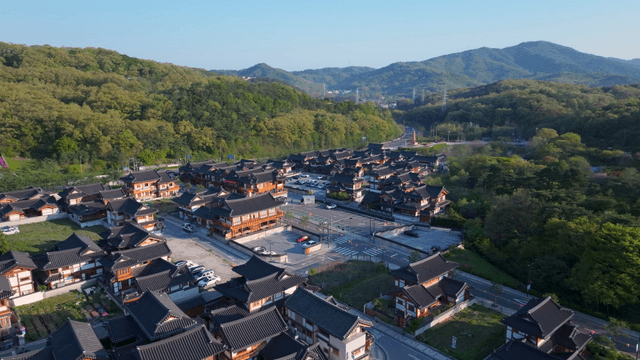 Traditional hanok village surrounded by mountains