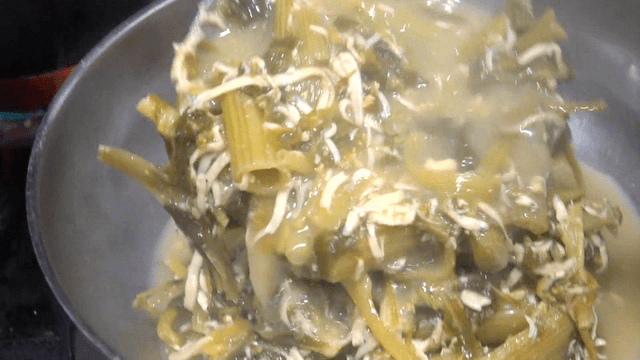 Ice fish and spinach soybean paste soup served in steel bowl