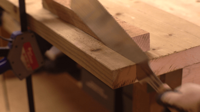 Wood being cut with a saw in a workshop