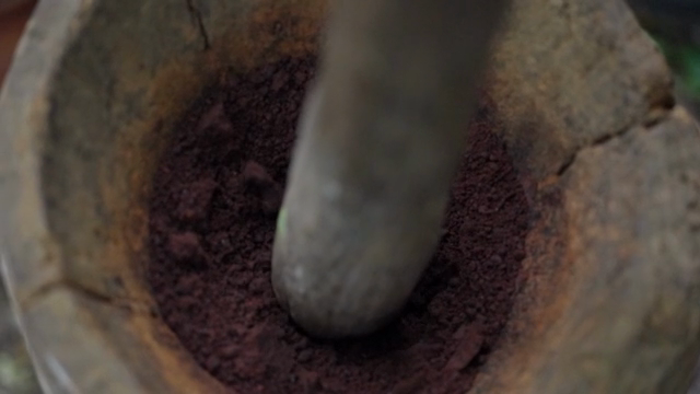Grinding ingredients in a mortar