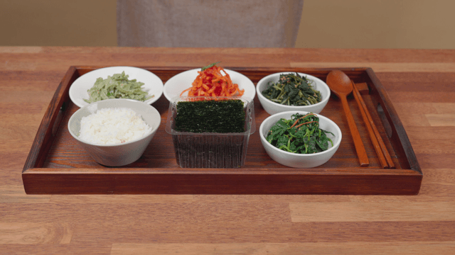 Korean side dishes with rice and seaweed