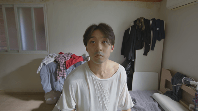 Person waking up in a messy room