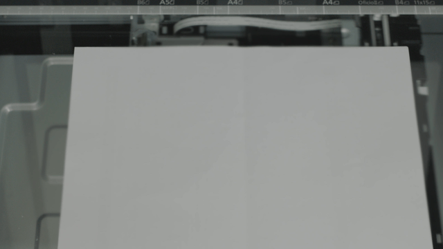 Photocopier scanning a sheet