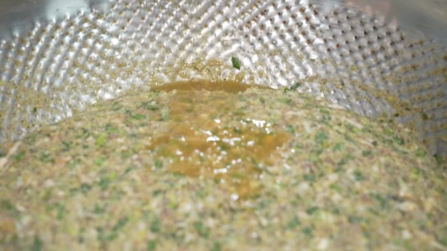 Adding sauce to dumpling filling