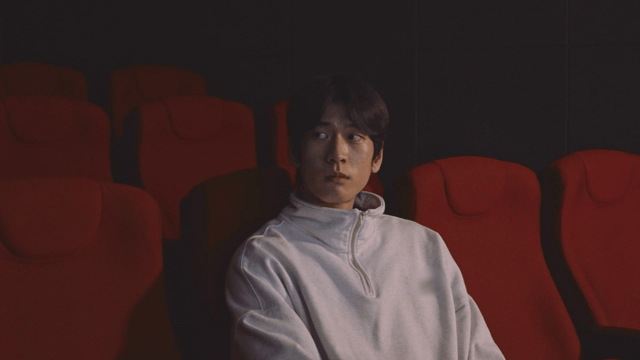 Man watching a movie in a theater