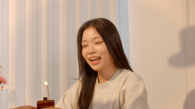 Couple celebrating at home with birthday cake