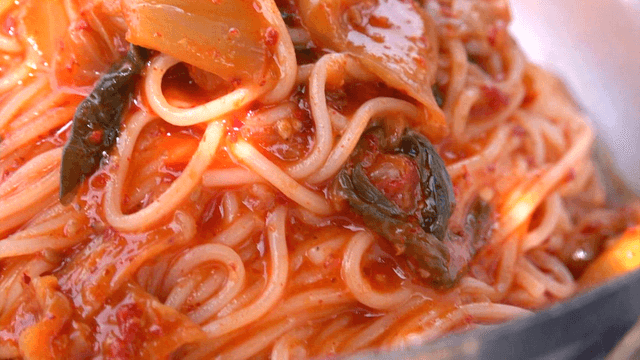 Spicy kimchi bibim noodles in a bowl