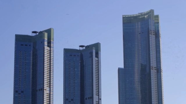 Tall skyscrapers under a clear blue sky
