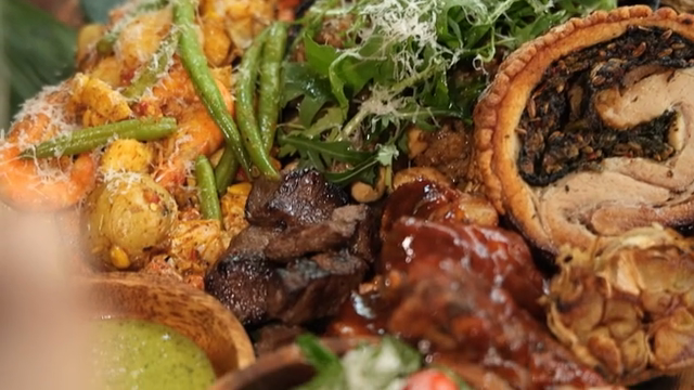 A barbecue plate with a variety of foods