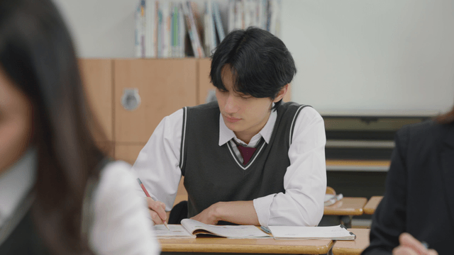 Student focused on class in a classroom