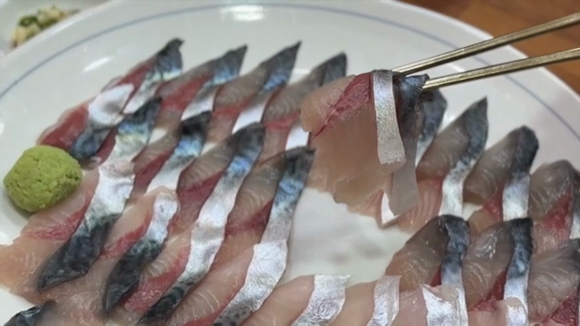 Sliced mackerel arranged on a plate