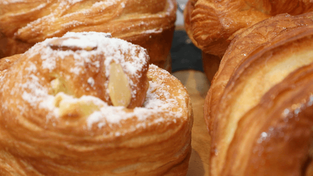 Freshly baked pastries with powdered sugar
