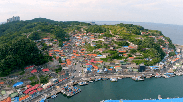 Colorful roofs and boats settled in a coastal village