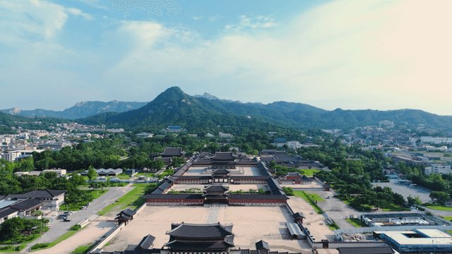 Historic palace with mountains in the background
