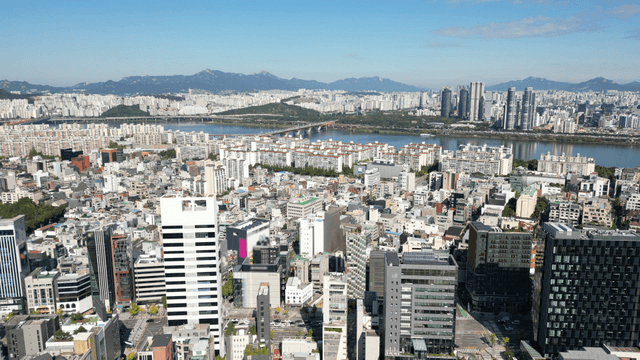 Clear sky above the wide Seoul cityscape