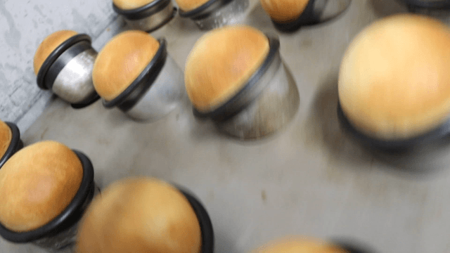Freshly baked bread taken out of an oven