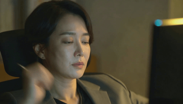 Tired office worker stretching on an office chair