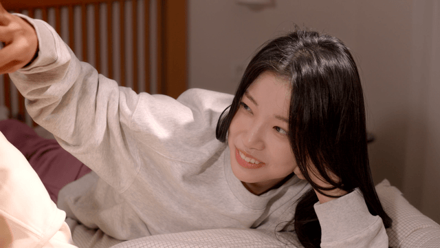 Couple talking comfortably on bedroom bed