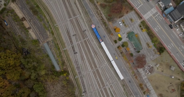 Train station with tracks and nearby park