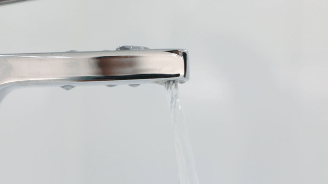Water flowing from a modern faucet