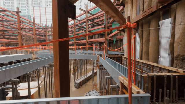 Construction site with metal beams and scaffolding
