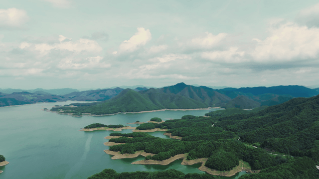 Vast lake surrounded by lush mountains