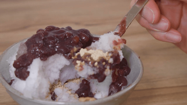 Taking a spoonful of Korean shaved ice