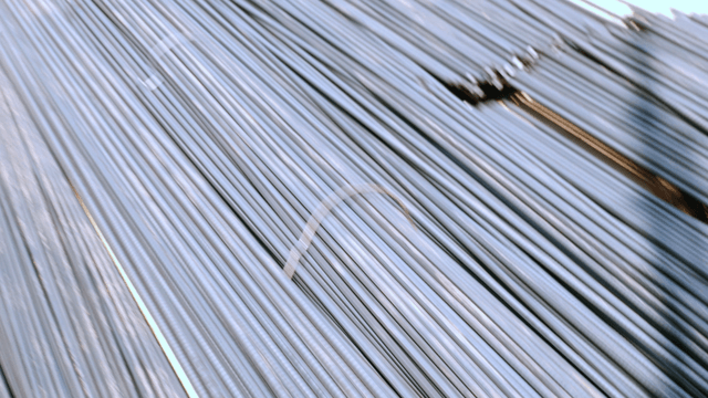 Steel rods stacked at a construction site