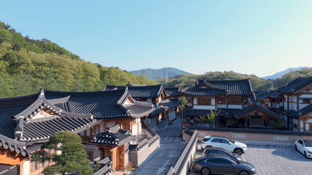 Traditional hanok village with view of hill