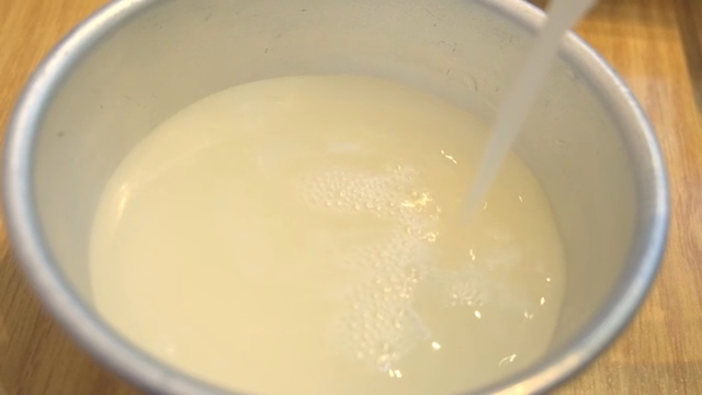 Pouring Unrefined Rice Wine into a glass