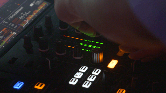 DJ mixing with colorful lights