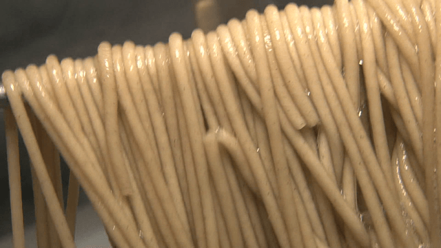 Noodles being cooked in boiling water