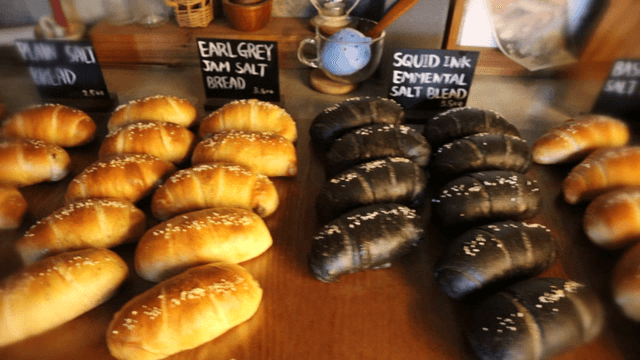Various types of bread displayed on a bakery