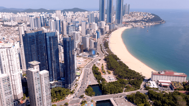 Coastal city with skyscrapers and a beach