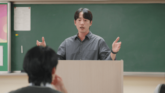 Teacher giving a lecture in a classroom