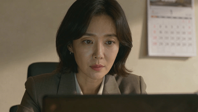 Middle-aged office worker focused on laptop work