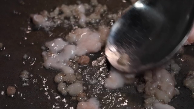Cooking meat in a pan with oil