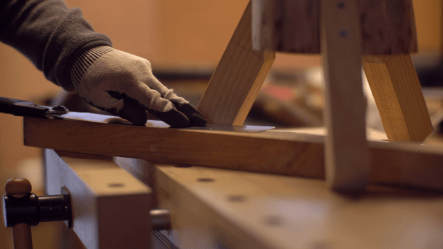 Craftsman working on a wooden piece