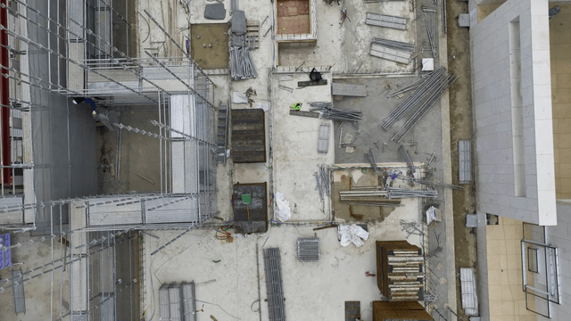 Construction site with workers and materials