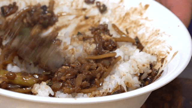 Mixing rice with savory black bean sauce