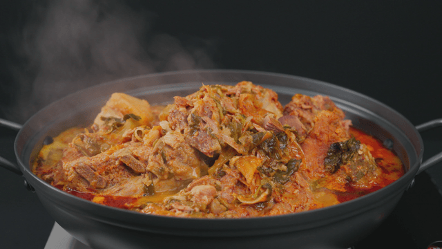Pork backbone stew boiling in pot