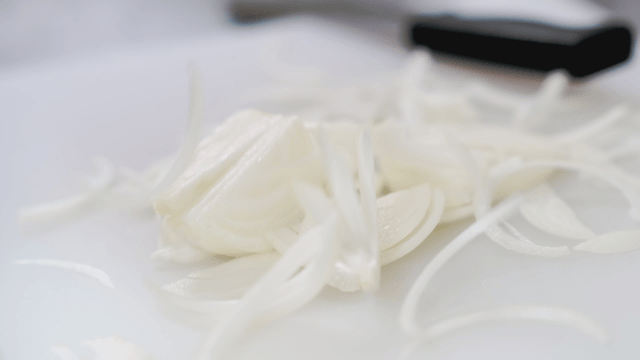Sliced onions on a cutting board