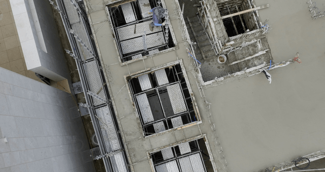 Construction site with workers and scaffolding