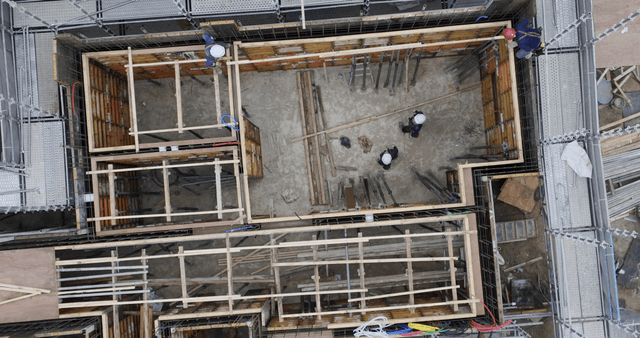 Construction site with workers and materials