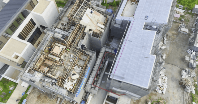 Construction site with workers and materials