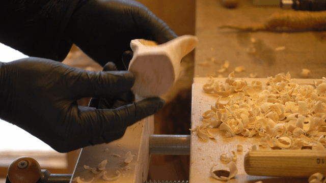 Delicately carved wooden serving spoon head