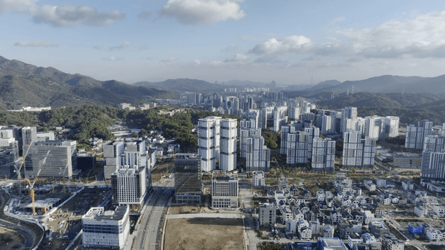 Sprawling cityscape with mountains
